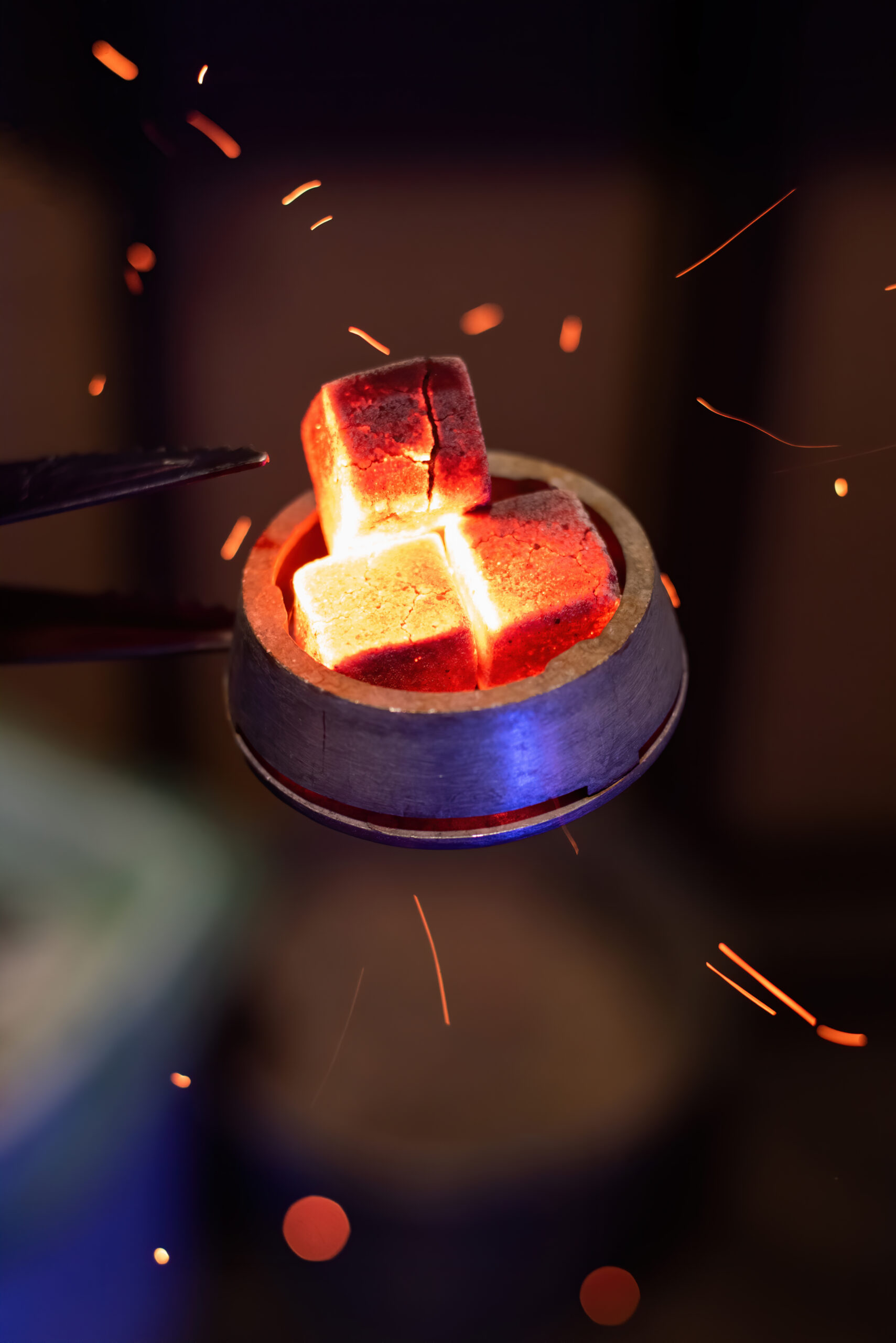 Hookah bowl with heated coals Hookah bowl with heated coals on it, particles flying around